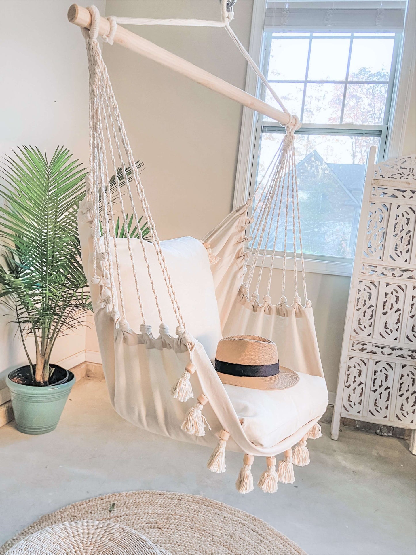 Boho Hammock Chair With Tassels and planter by the window