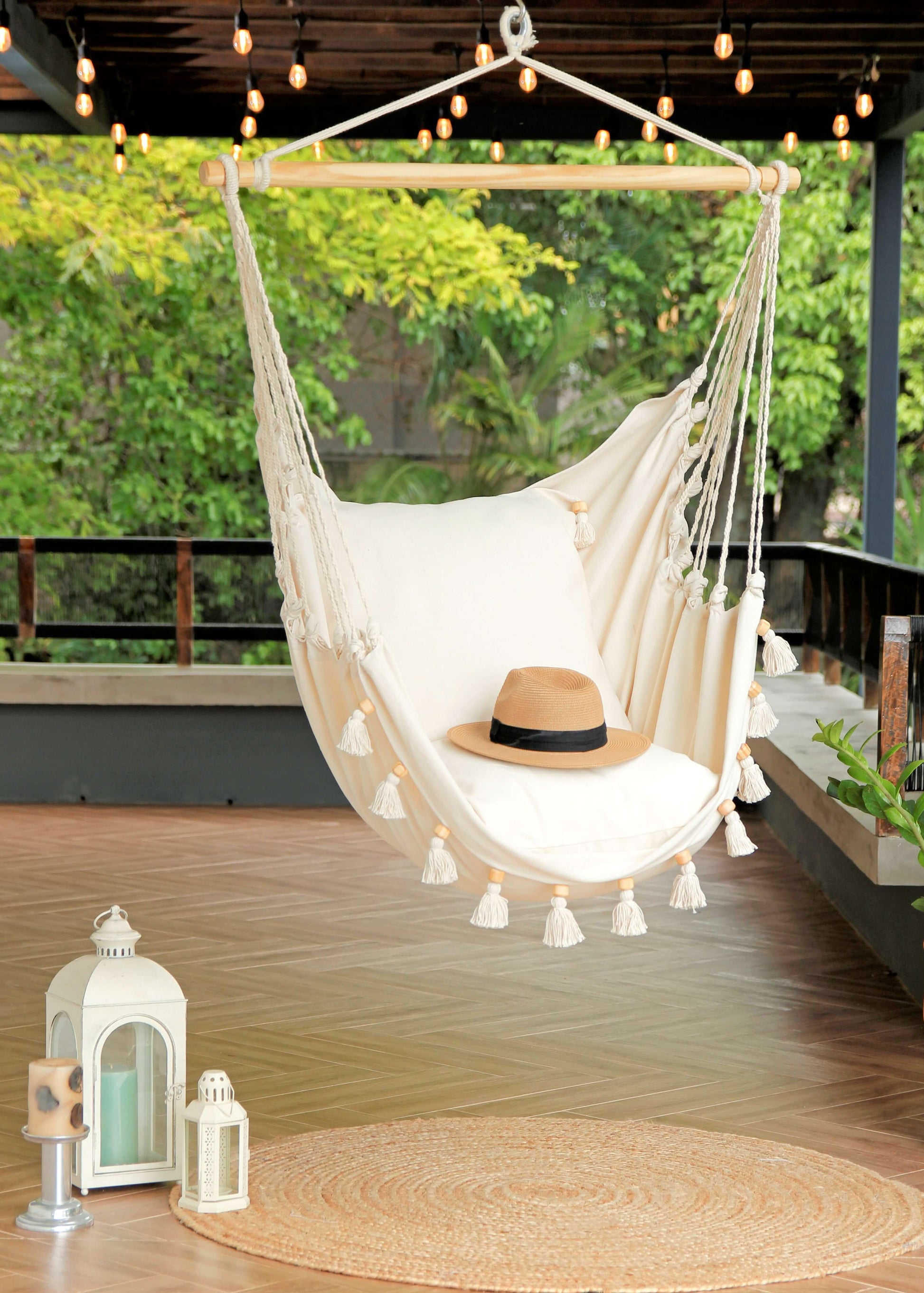 Boho Hammock Chair With Tassels in a porch with jute rug