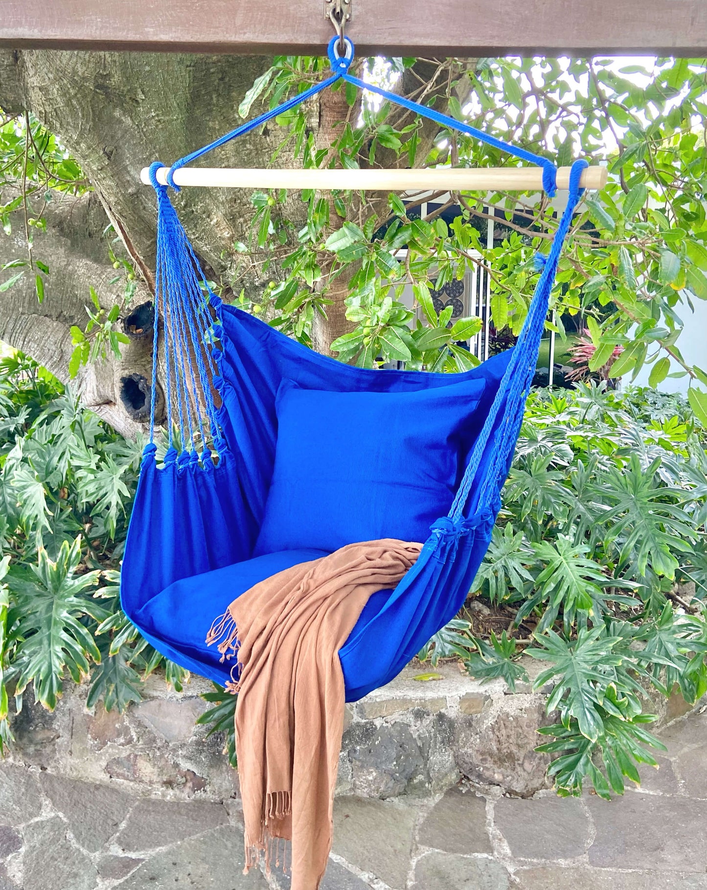 blue hammock chair with swing in a garden