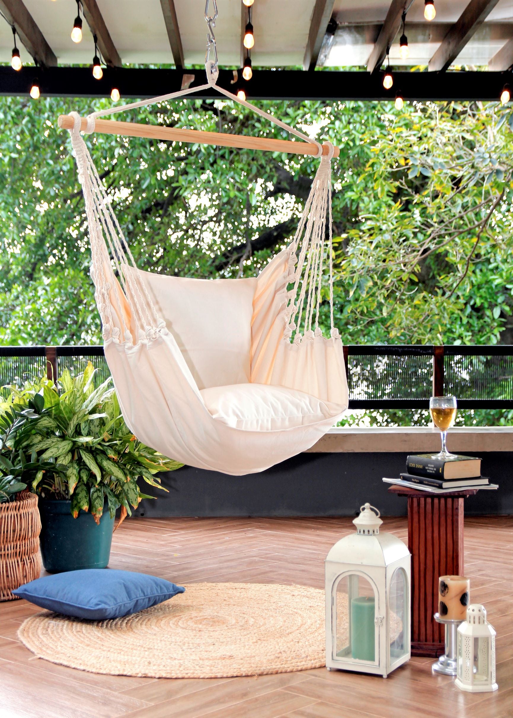 Hanging hammock chair swing on a porch with trees
