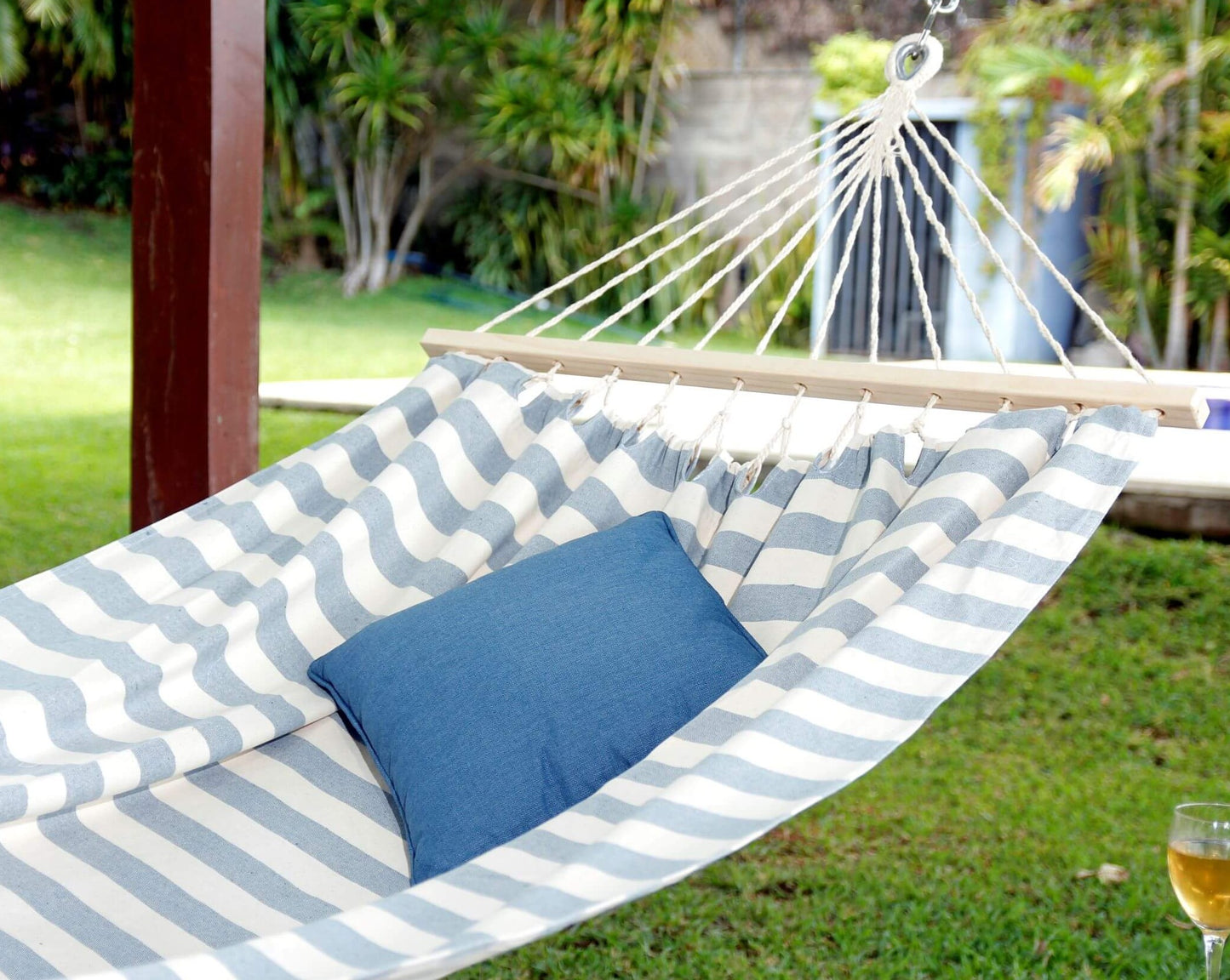 white and blue hammock with spreader bars