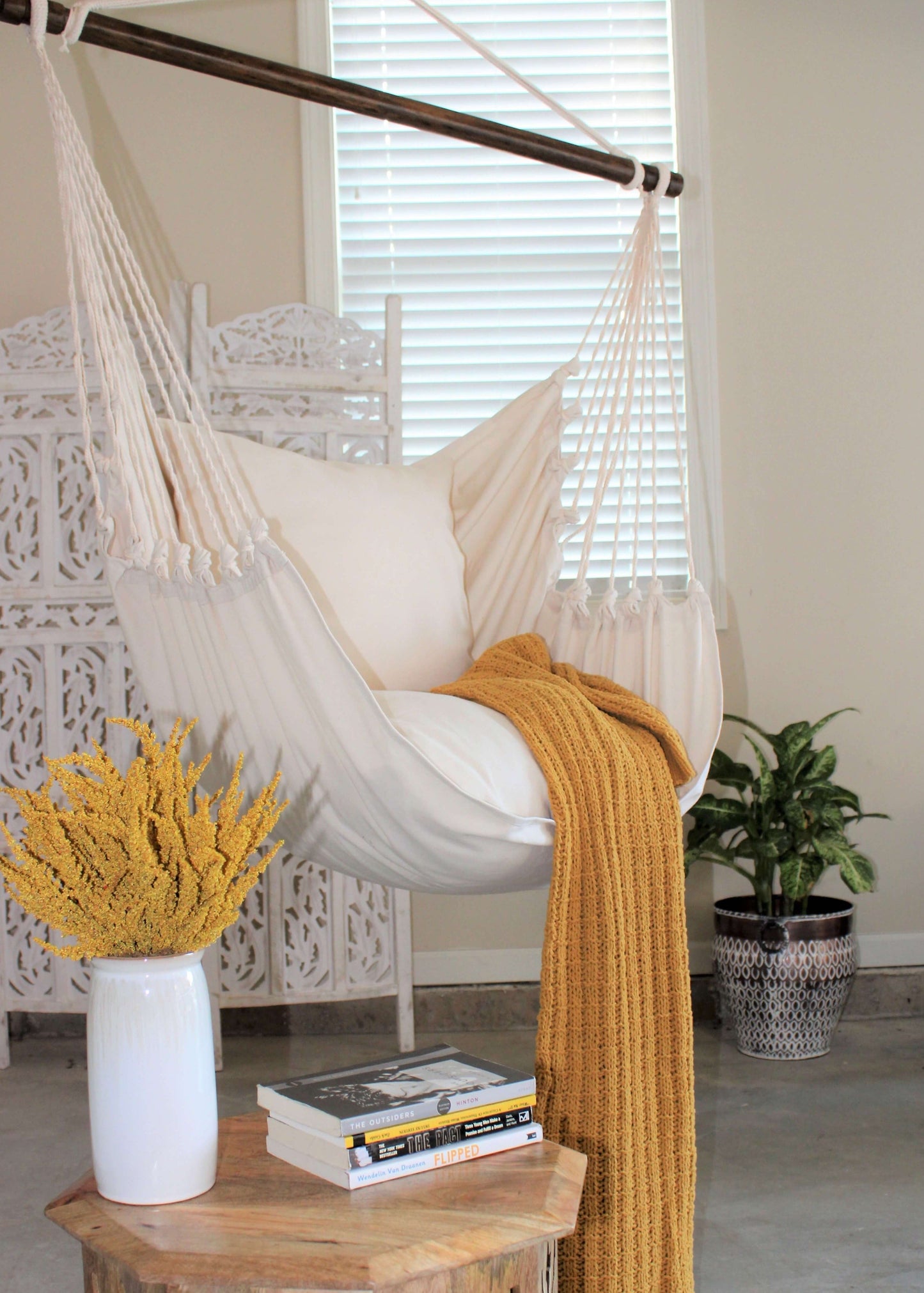 White Hanging hammock chair swing with yellow blanket