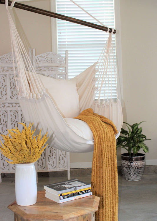 White Hanging hammock chair swing with yellow blanket