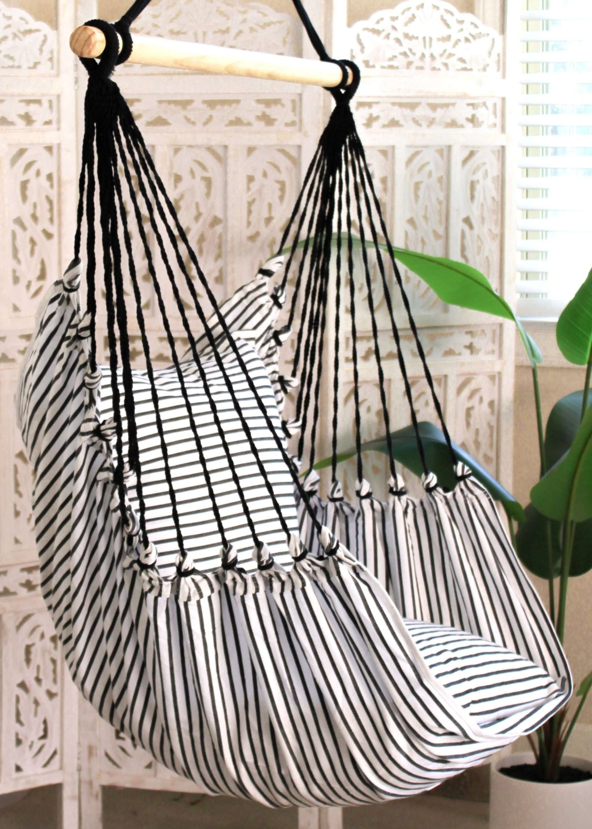 striped black and white hammock chair indoors