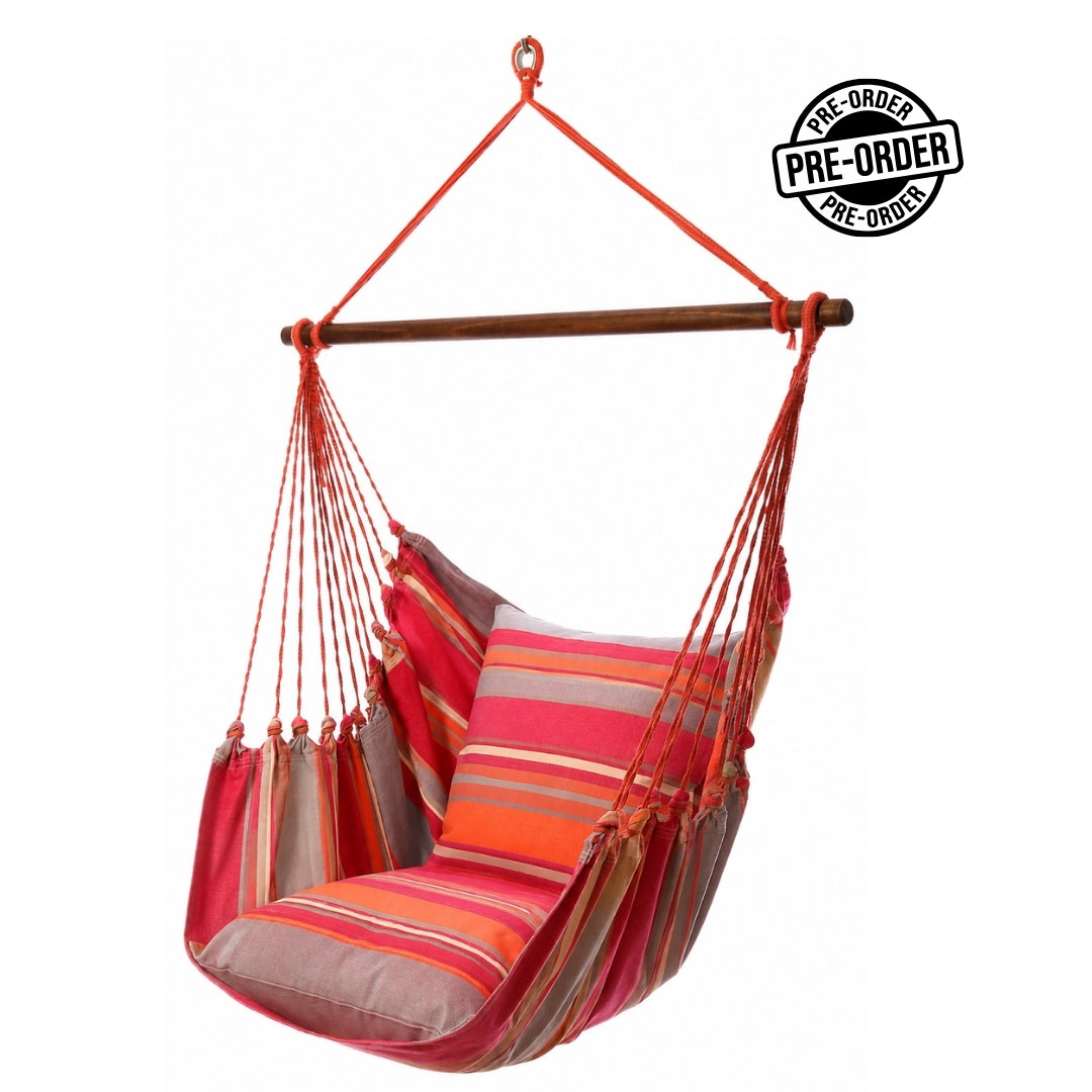 A  colorful hammock chair with  red orange and  bright pink cushions on white background 