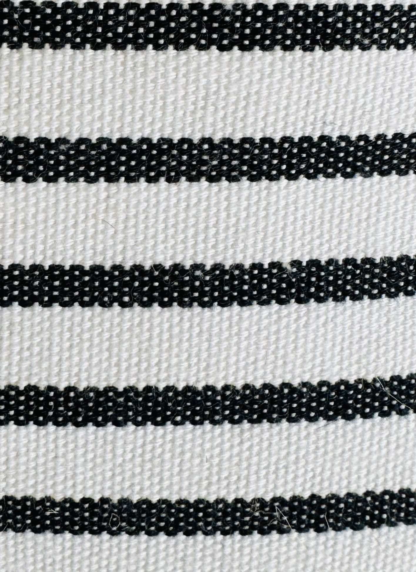 striped black and white hammock chair indoors