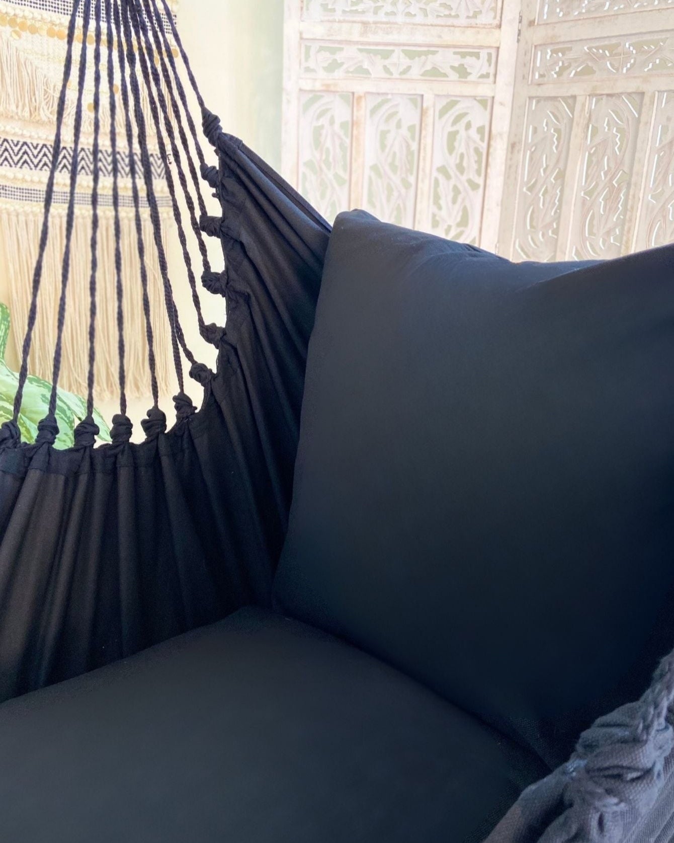 black hammock chair with pillow cushions