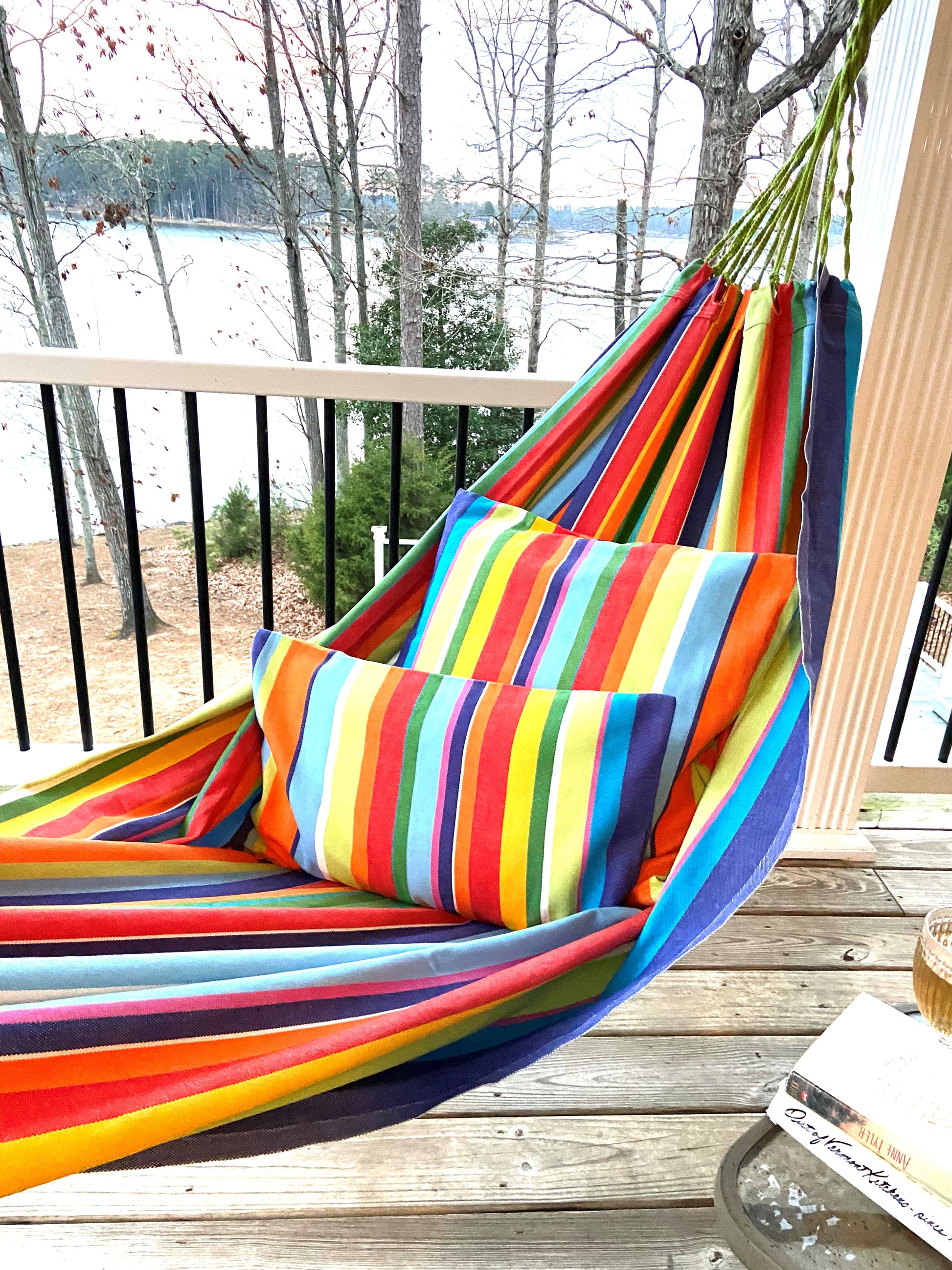 rainbow multi color hammock on a deck