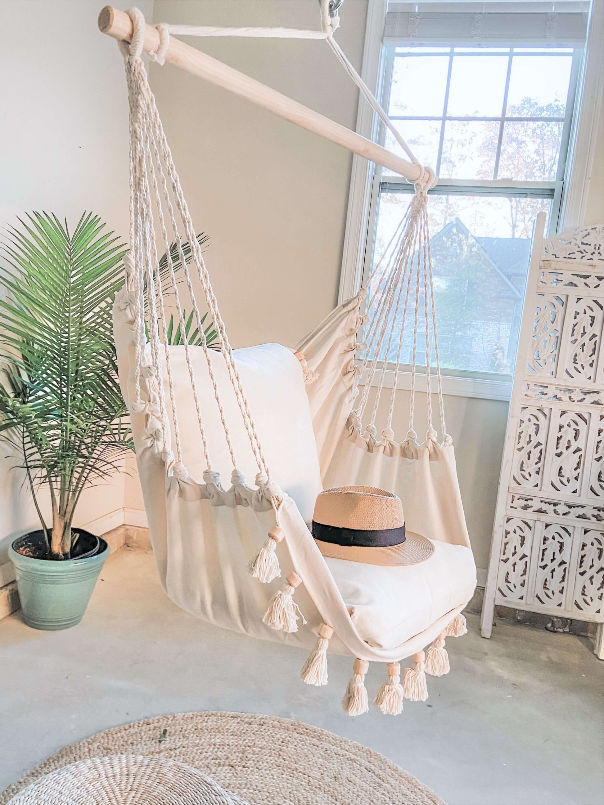 Boho Hammock Chair With Tassels and planter by the window