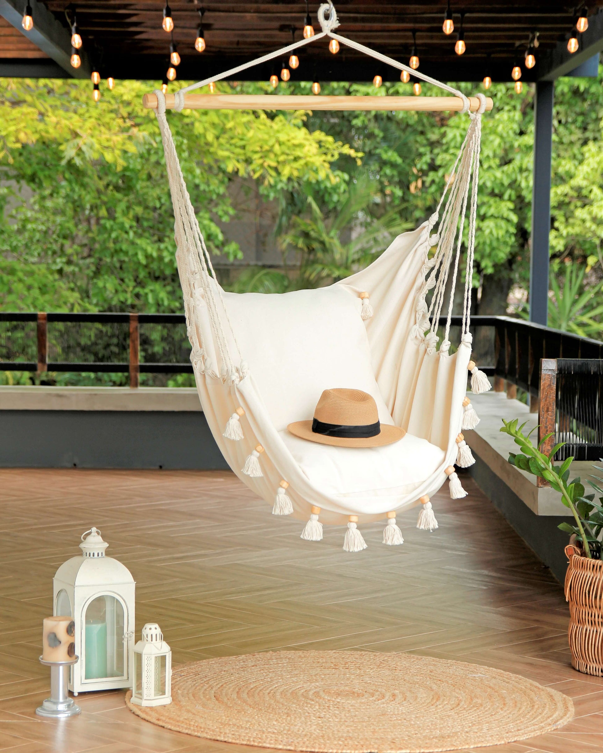Boho Hammock Chair With Tassels in a porch with jute rug 