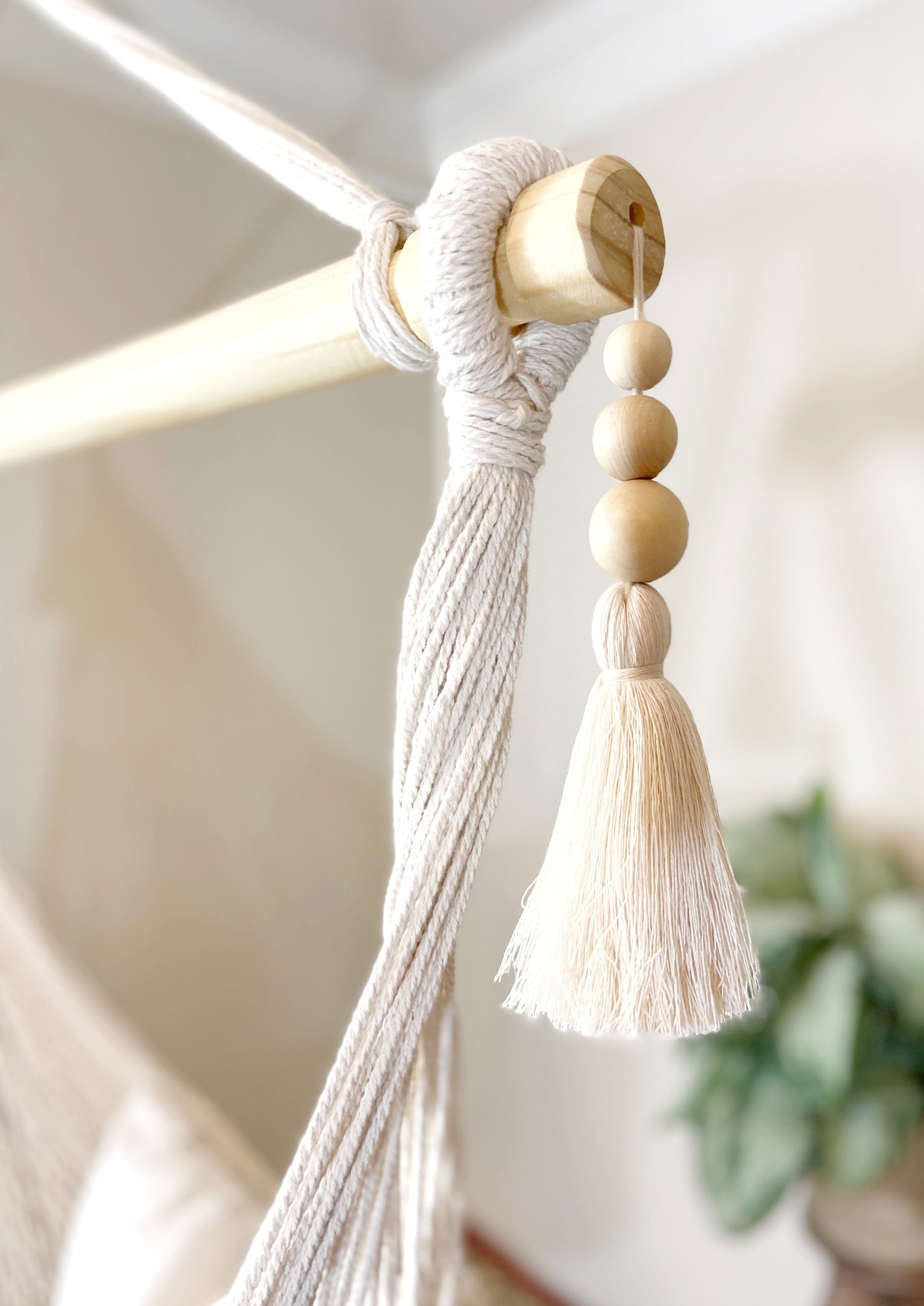 tassels on a woven macrame hanging chair