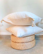cream pillow with tassels
